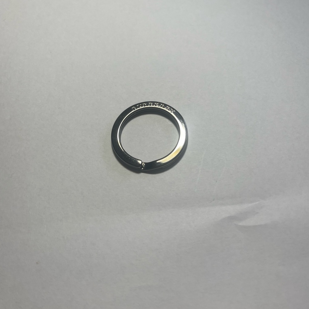 Burberry authentic ring to hold keys or purse charm. Dark metal
